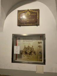 Plaque about Wolfgang Amadeus Mozart and information on the Treasury of the German Order at the Deutschordenshaus Wien, by night