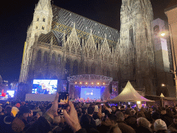 The Stephansplatz square with a Silvesterpfad stage and the southwest side of St. Stephen`s Cathedral, by night