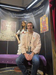 Tim with a statue of one of the Primavesi Sisters by Gustav Klimt at the `Music in Vienna` section at the Time Travel Vienna museum, with explanation