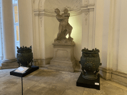 Statue and vases at the entrance hall of the Palais Daun-Kinsky palace