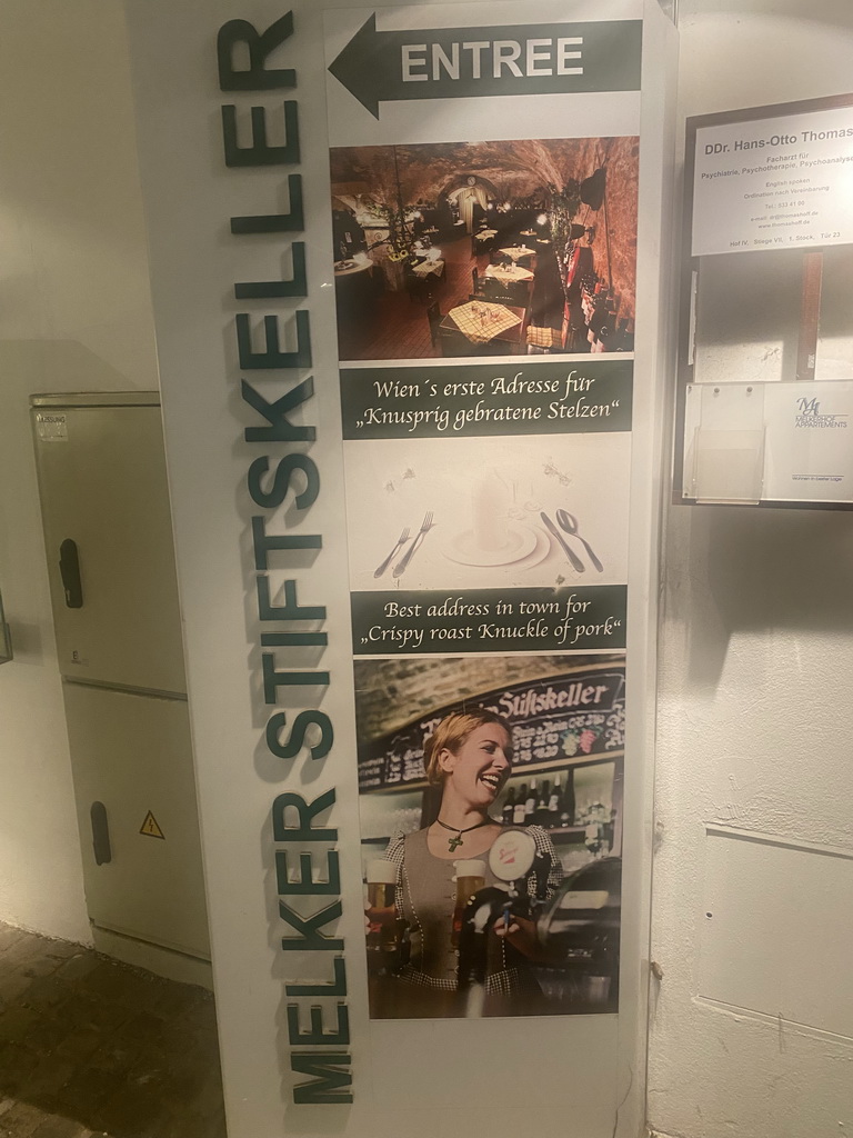 Sign at the entrance to the Melker Stiftskeller restaurant at the Schottengasse street, by night