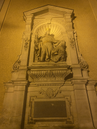 Relief at the front of the Benediktushaus im Schottenstift hotel at the Freyung square, by night