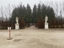 Statues in front of the road leading to the Beim Fischbassin pond at the Schönbrunn Park