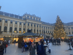 Parade Court with christmas tree and christmas stalls in front of the Schönbrunn Palace, at sunset