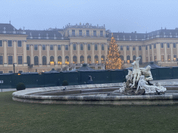 Parade Court with the Eastern Parade Court Fountain, christmas tree and christmas stalls in front of the Schönbrunn Palace, at sunset