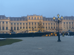 The Parade Court with christmas tree and christmas stalls in front of the Schönbrunn Palace, at sunset