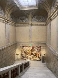 Staircase from the second to the first floor of the Kunsthistorisches Museum Wien with a poster of the exhibition `The Habsburg Rule in North Africa`