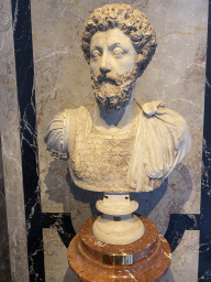 Bust of Emperor Marcus Aurelius at the entrance to the Collection of Greek and Roman Antiquities at the upper ground floor of the Kunsthistorisches Museum Wien, with explanation