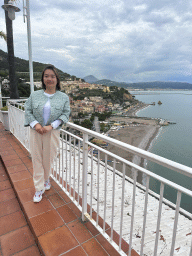 Miaomiao at the roof terrace of the Hotel Voce del Mare, with a view on the city center with the Chiesa Parrocchiale di San Giovanni Battista church, the Lido California beach, the Tyrrhenian Sea and the city of Salerno