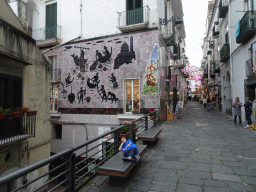 Max and painted tiles at the crossing of the Via Lauretta d`Arienzo and the Corso Umberto I streets