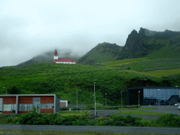 The Vikurkirkja church and mountains, viewed from a parking lot along the Þjóðvegur road