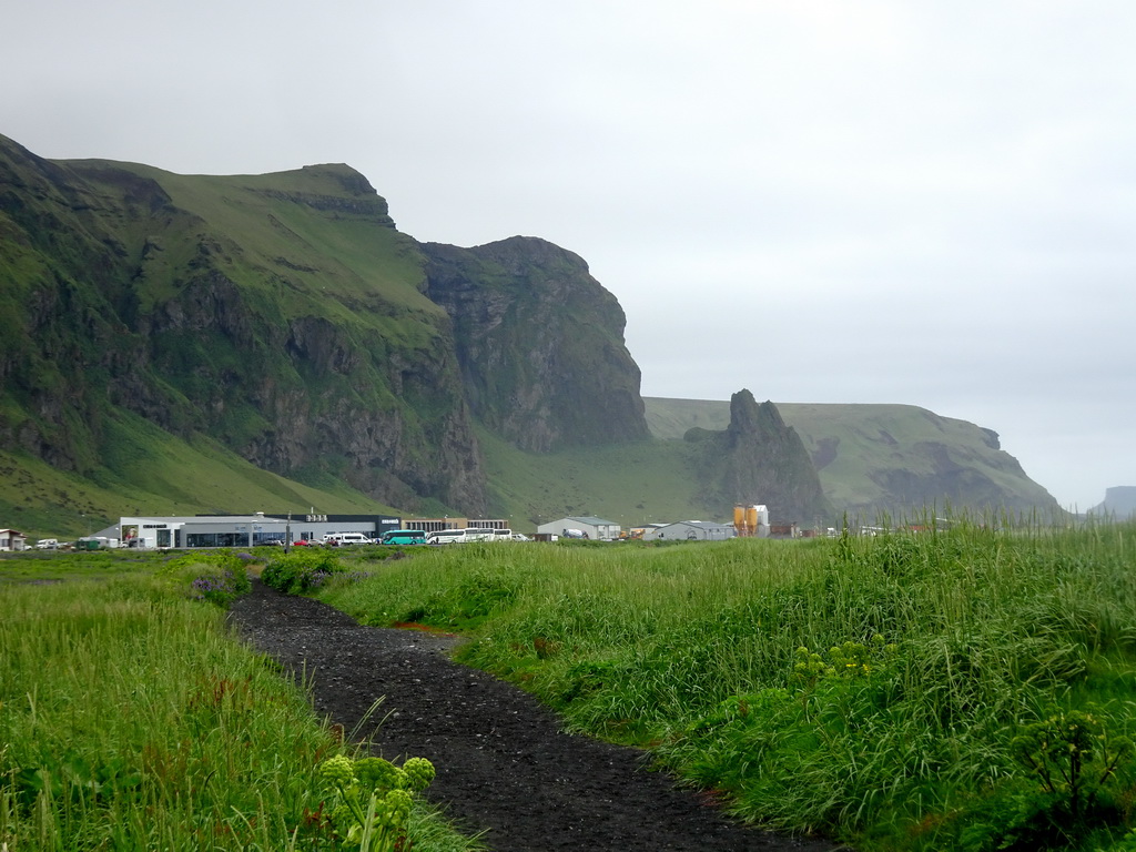 Buildings at the west side of town and mountains, viewed from the parking lot of the Black Sand Beach