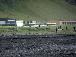 Horse riders at the west side of town, viewed from the Black Sand Beach