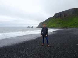 Tim at the west side of the Black Sand Beach with the Reynisdrangar rocks