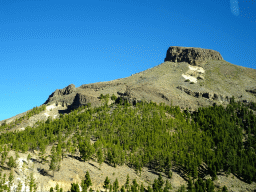 The Sombrero de Chasna mountain and trees on the southwest side of the Teide National Park, viewed from the rental car on the TF-21 road