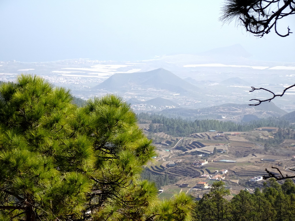 Terraces at the town of La Escalona and mountains, hills and greenhouses on the south side of the island, viewed from a parking place along the TF-21 road