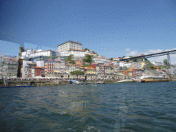 Porto with the Cais da Ribeira street, the Igreja dos Grilos church and the Paço Episcopal do Porto palace and the Ponte Luís I bridge over the Douro river, viewed from the ferry from Porto