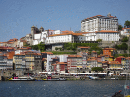 Boats on the Douro river and Porto with the Cais da Ribeira street, the Igreja dos Grilos church and the Paço Episcopal do Porto palace, viewed from the Avenida de Diogo Leite street