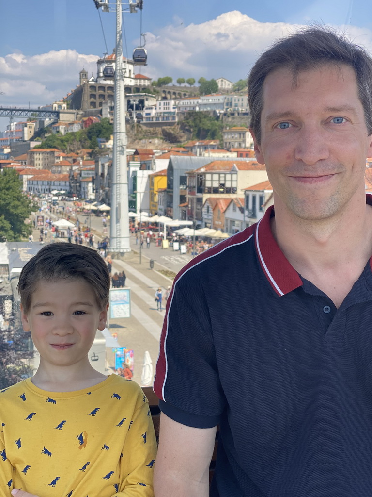 Tim and Max at the Gaia Cable Car, with a view on the Avenida de Diogo Leite street and the Mosteiro da Serra do Pilar monastery