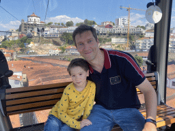Tim and Max at the Gaia Cable Car, with a view on the Mosteiro da Serra do Pilar monastery