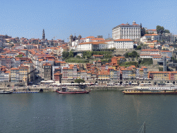 Boats on the Douro river and Porto with the Cais da Ribeira street, the Torre dos Clérigos tower, the Igreja dos Grilos church and the Paço Episcopal do Porto palace, viewed from the Gaia Cable Car