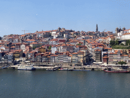 Boats on the Douro river and Porto with the Cais da Ribeira street, the Capela de Nossa Senhora do Ó chapel, the Mercado Ferreira Borges market, the Igreja de Nossa Senhora da Vitória church, the Torre dos Clérigos tower, the Igreja dos Grilos church and the Paço Episcopal do Porto palace, viewed from the Gaia Cable Car