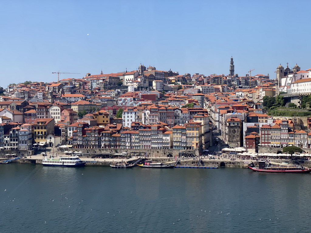 Boats on the Douro river and Porto with the Cais da Ribeira street, the Capela de Nossa Senhora do Ó chapel, the Mercado Ferreira Borges market, the Igreja de Nossa Senhora da Vitória church, the Torre dos Clérigos tower, the Igreja dos Grilos church and the Paço Episcopal do Porto palace, viewed from the Gaia Cable Car