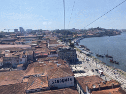 Boats on the Douro river and the city center with the Avenida de Diogo Leite street, viewed from the Gaia Cable Car