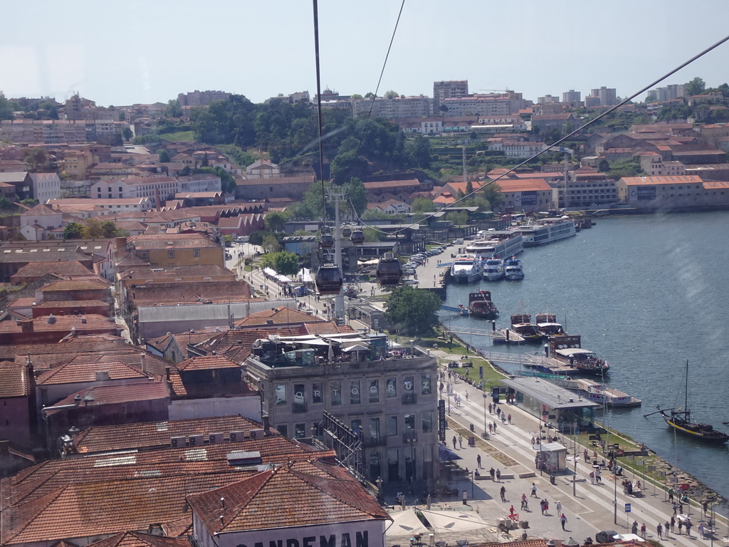 Boats on the Douro river and the city center with the Avenida de Diogo Leite street, viewed from the Gaia Cable Car