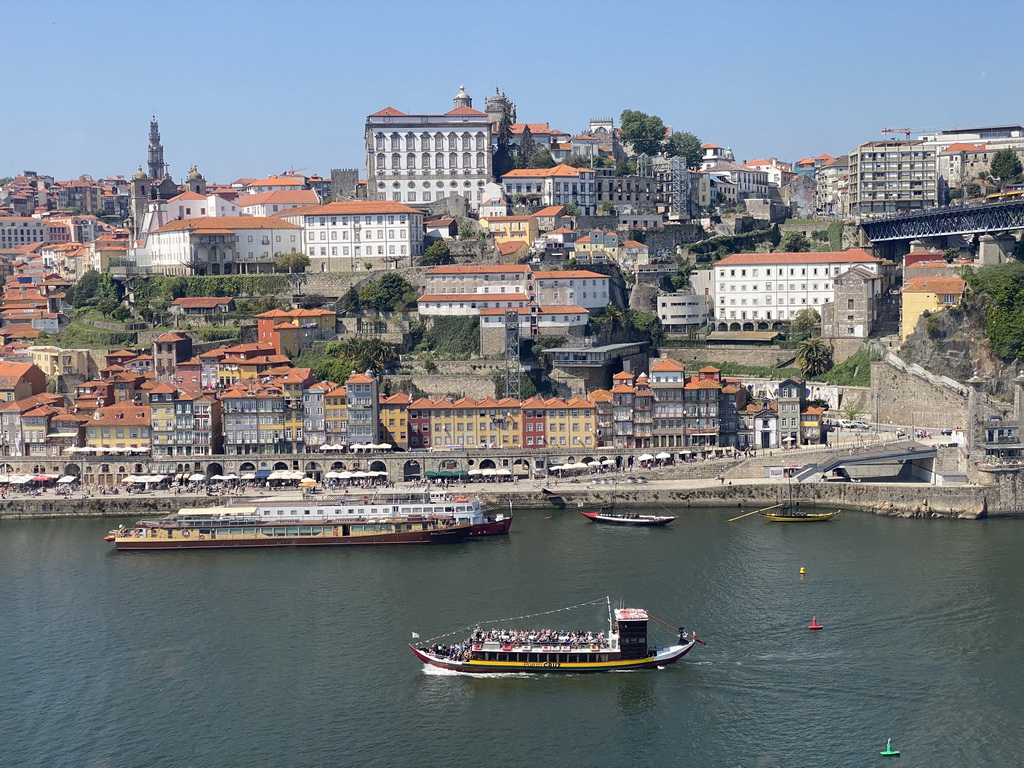 Boats on the Douro river and Porto with the Cais da Ribeira street, the Torre dos Clérigos tower, the Igreja dos Grilos church, the Porto Cathedral and the Paço Episcopal do Porto palace, viewed from the Gaia Cable Car