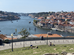 The Ponte da Arrábida bridge over the Douro river and Porto with the Cais da Estiva and Cais da Ribeira streets, viewed from the rock hill at the Jardim do Morro park