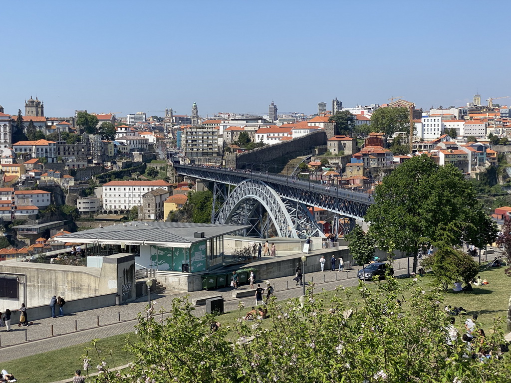 The Ponte Luís I bridge over the Douro river, the Gaia Cable Car building and Porto with the Paço Episcopal do Porto palace and the Muralha Fernandina wall, viewed from the rock hill at the Jardim do Morro park