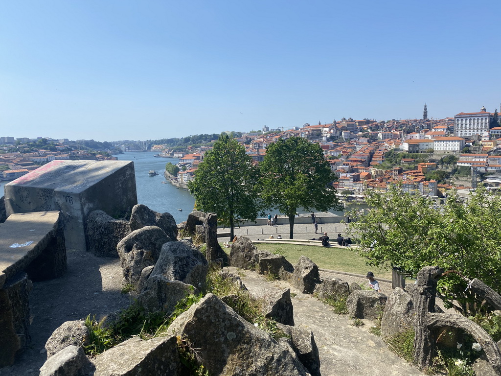 The rock hill at the Jardim do Morro park, with a view on the Ponte da Arrábida bridge over the Douro river and Porto with the Torre dos Clérigos tower and the Paço Episcopal do Porto palace