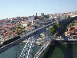 Subway train on the Ponte Luís I bridge over the Douro river and Porto with the Igreja de Nossa Senhora da Vitória church, the Paço Episcopal do Porto palace, the Torre dos Clérigos tower, the Porto Cathedral and the Muralha Fernandina wall, viewed from the Miradouro da Serra do Pilar viewing point at the Largo Aviz square