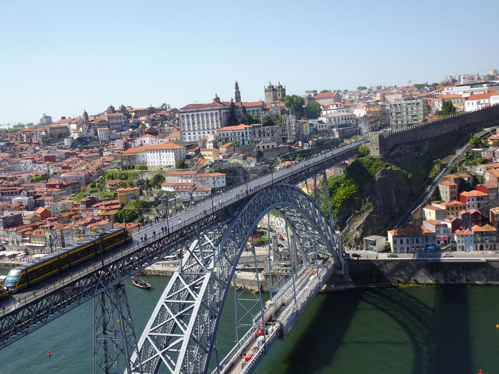 Subway train on the Ponte Luís I bridge over the Douro river and Porto with the Igreja de Nossa Senhora da Vitória church, the Paço Episcopal do Porto palace, the Torre dos Clérigos tower, the Porto Cathedral and the Muralha Fernandina wall, viewed from the Miradouro da Serra do Pilar viewing point at the Largo Aviz square