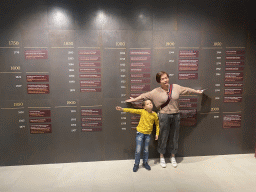 Miaomiao in front of the timeline at the Chocolate Story museum at the WOW Cultural District