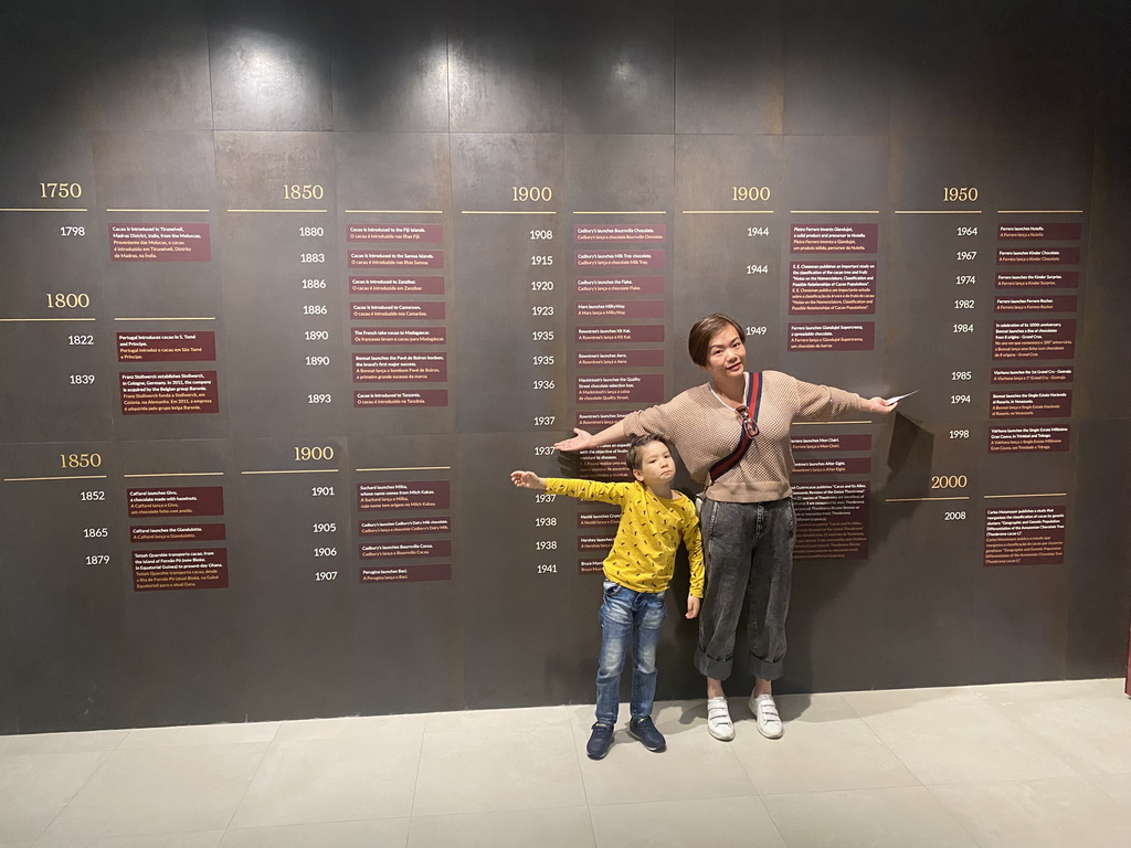 Miaomiao in front of the timeline at the Chocolate Story museum at the WOW Cultural District