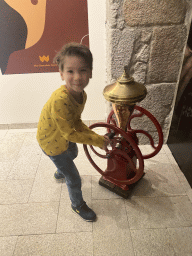 Max with a machine at the Chocolate Story museum at the WOW Cultural District