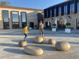 Miaomiao and Max with stepping stones at the Main Square at the WOW Cultural District