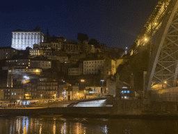 The Ponte Luís I bridge over the Douro river and Porto with the Paço Episcopal do Porto palace, viewed from the Avenida de Diogo Leite street, by night