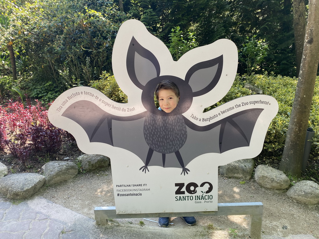 Max with a cardboard with a Bat at the Zoo Santo Inácio