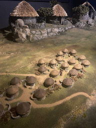 Scale model of a prehistoric village at the Porto Region Across the Ages museum at the WOW Cultural District