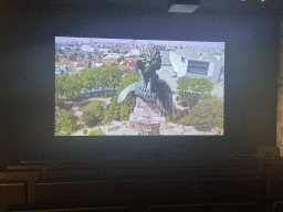 TV screen with a movie about the Monumento aos Heróis da Guerra Peninsular column and the Casa da Música theatre at the Porto Region Across the Ages museum at the WOW Cultural District