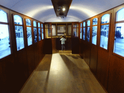 Max at the steering wheel of a tram at the Porto Region Across the Ages museum at the WOW Cultural District