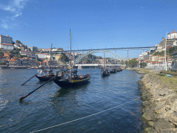 Boats and the Ponte Luís I bridge over the Douro river, the Mosteiro da Serra do Pilar monastery and Porto with the Paço Episcopal do Porto palace, viewed from the ferry dock