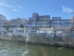 Front of buildings at the Cais da Ribeira street, viewed from the ferry over the Douro river
