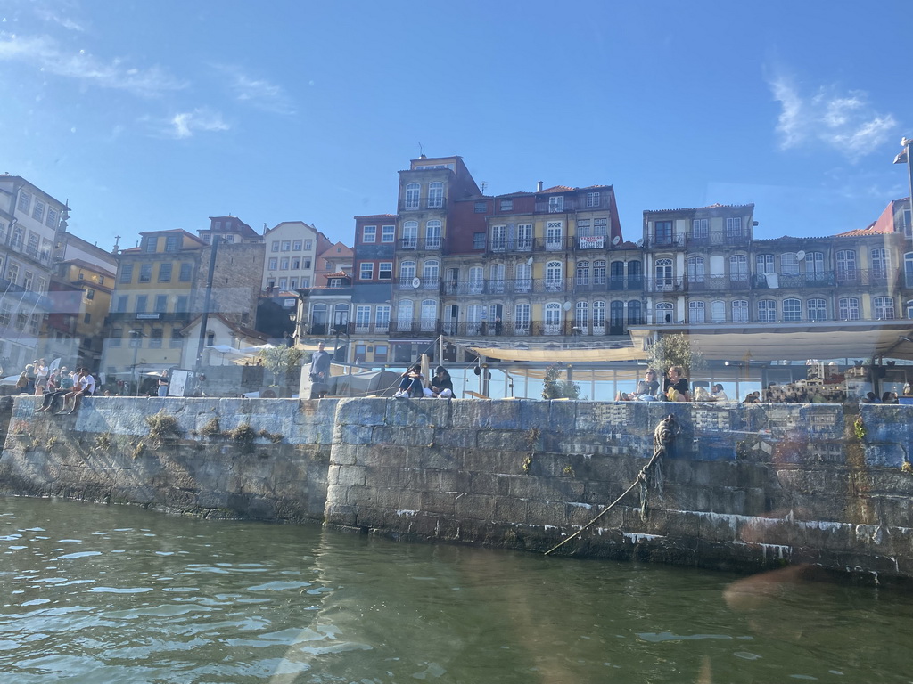 Front of buildings at the Cais da Ribeira street, viewed from the ferry over the Douro river