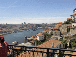 Boats over the Douro river, the Avenida de Diogo Leite street and Porto with the Elevador da Ribeira lift, viewed from the subway train on the Ponte Luís I bridge