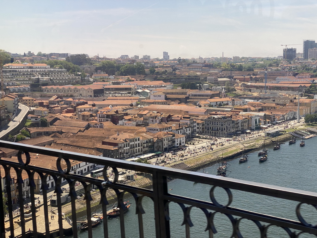 Boats over the Douro river, the Avenida de Diogo Leite street, the Igreja Paroquial de Santa Marinha church and the Gaia Cable Car, viewed from the subway train on the Ponte Luís I bridge