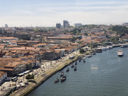 Boats over the Douro river, the Avenida de Diogo Leite street, the Igreja Paroquial de Santa Marinha church and the Gaia Cable Car, viewed from the subway train on the Ponte Luís I bridge